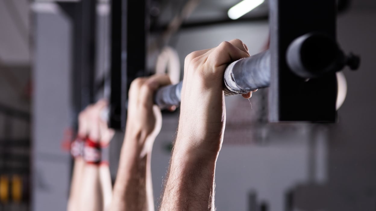 hanging from a pull-up bar