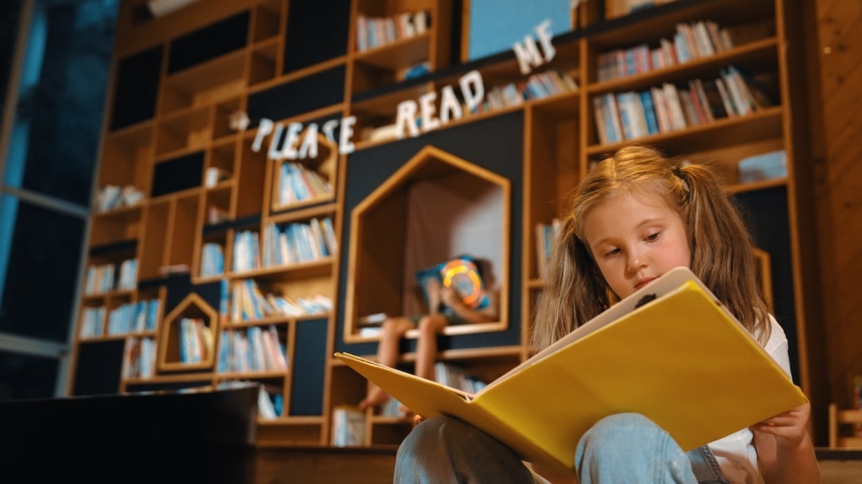 Girl reading in library 