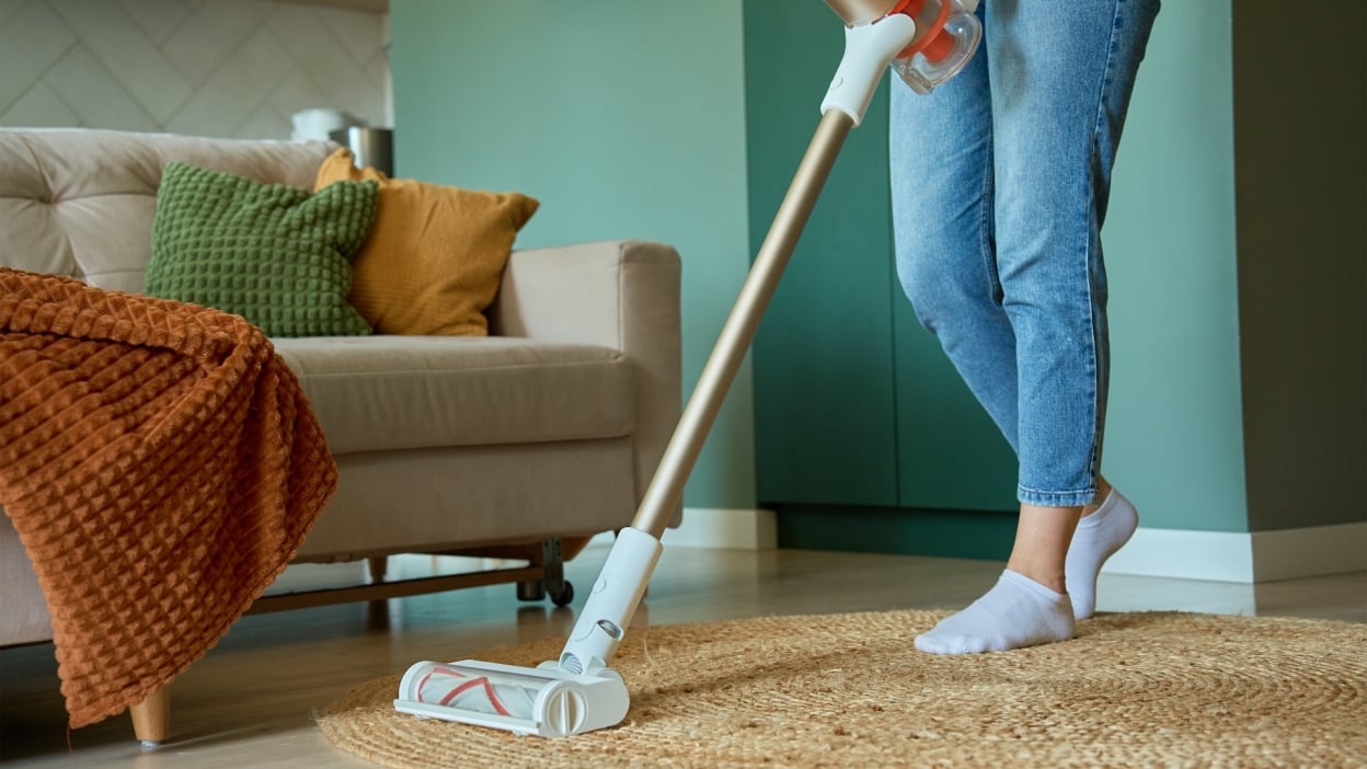 woman vacuuming a living room 