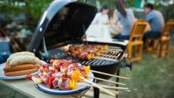 Close-up of kebabs on a charcoal grill.