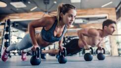 Man and woman working out in gym