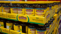 Bottles of magnesium supplements on a store shelf