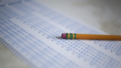 A pencil lying on top of a scantron test