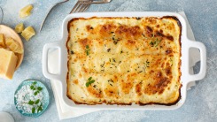 Scalloped potatoes on a table.