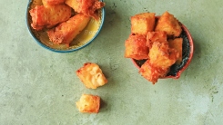 Mac and cheese cubes in two bowls.