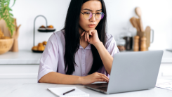 Woman focused on laptop