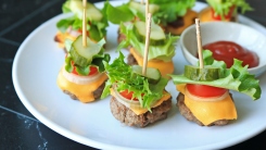 Small bun-less cheeseburgers on toothpicks