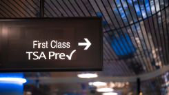 A photograph of a TSA PreCheck sign at an airport