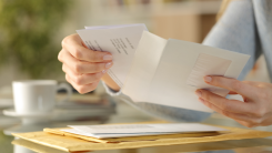 Closeup hands opening letter