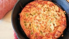 Pizza in a cast iron skillet