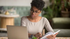 Woman focusing on laptop