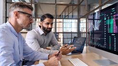 Two insurances bros looking at a screen