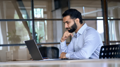 Man concentrating on laptop