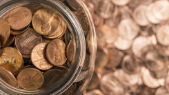 Pennies in jar, and in background