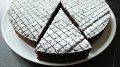 A close up of a slice of chocolate cake.