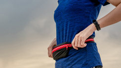 woman adjusting her running belt