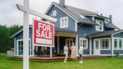 For Sale sign outside of a home with three people in background