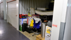 open door of a storage unit with items visible from the outside