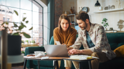 Couple working on taxes at home