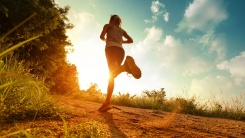 person running at sunrise...or is it sunset?