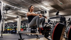 woman on a rower in the gym