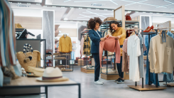 Women looking at clothes in store