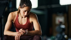 athlete checking her watch