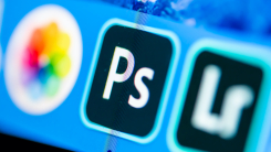 Photos, Adobe Photoshop & Adobe Lightroom apps on a desktop with pixels