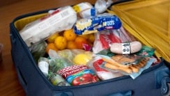 A bunch of food in a suitcase.