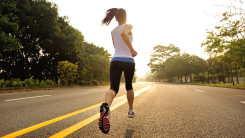 woman running down middle of road