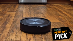 A screenshot of an iRobot Roomba robot vacuum in action moving across a wood floor