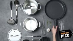 Overhead shot of pots and pans on a grey background