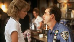 A screenshot of Nicholas Cage and Bridget Fonda from It Could Happen to You