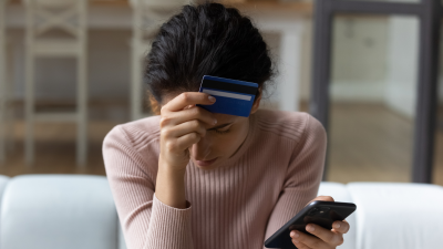 Upset woman with credit card