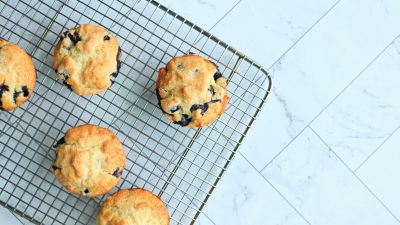 Blueberry muffins on a cooling rack.