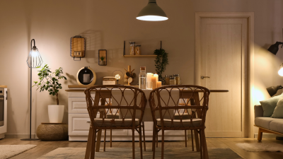 A cozy dining room with dramatic lighting, plants, and rattan chairs