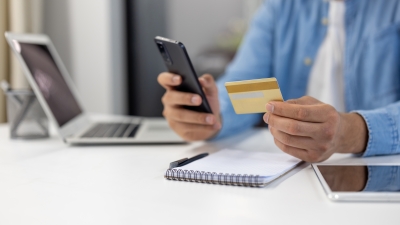 Man enters credit card info into phone.