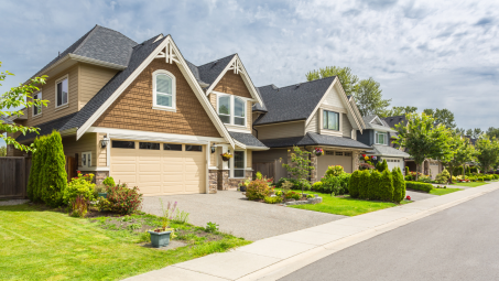 Sunny, manicured lawn of a nice neighborhood home.