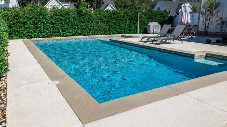 An in-ground backyard pool