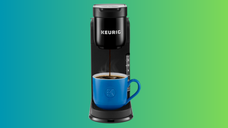 Keurig K-Express machine against a gradient background