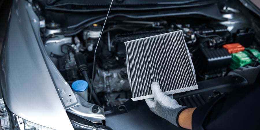 Auto mechanic doing something to car