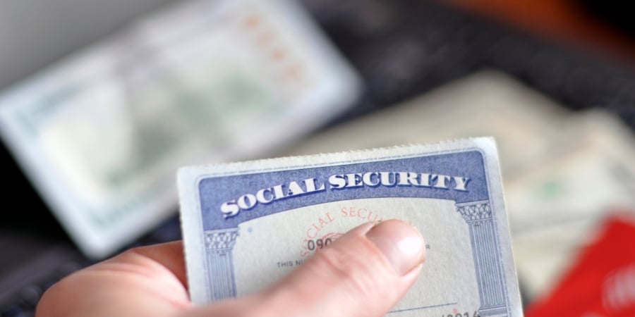 Person holding social security card