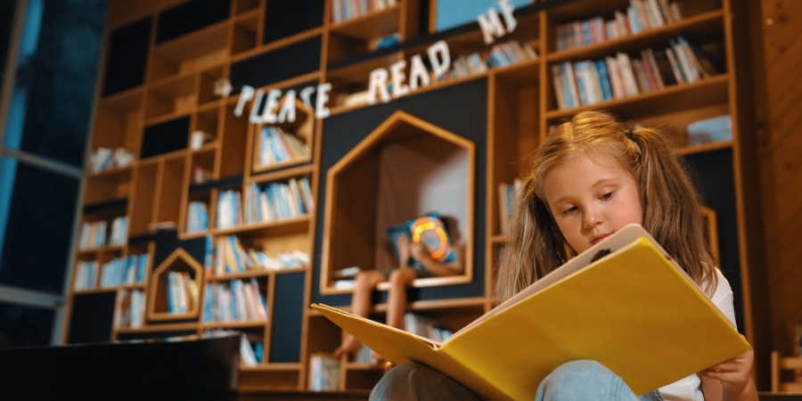 Girl reading in library 