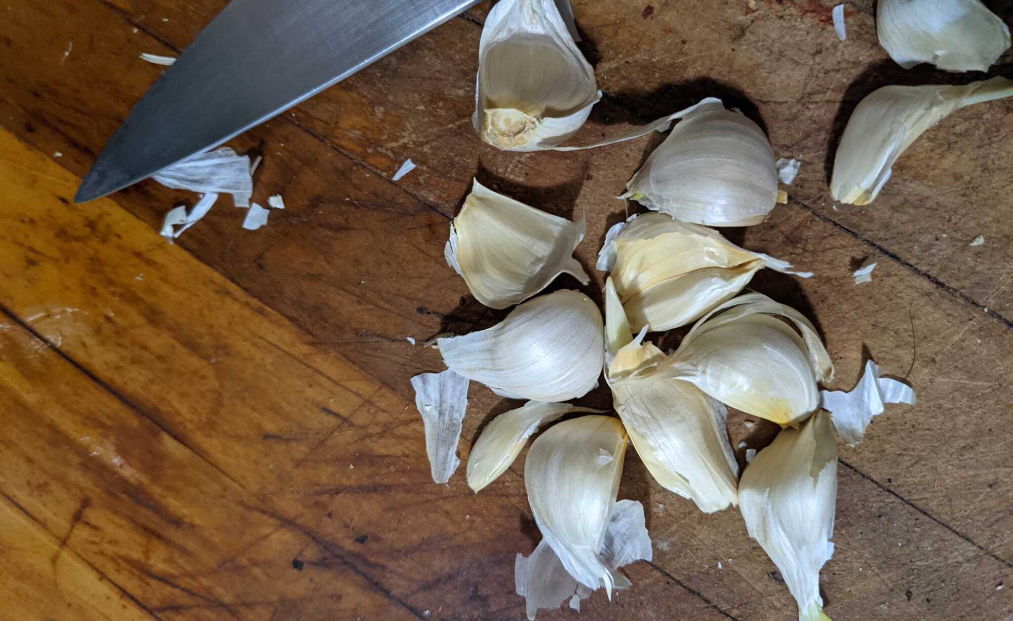 garlic cloves being separated to plant