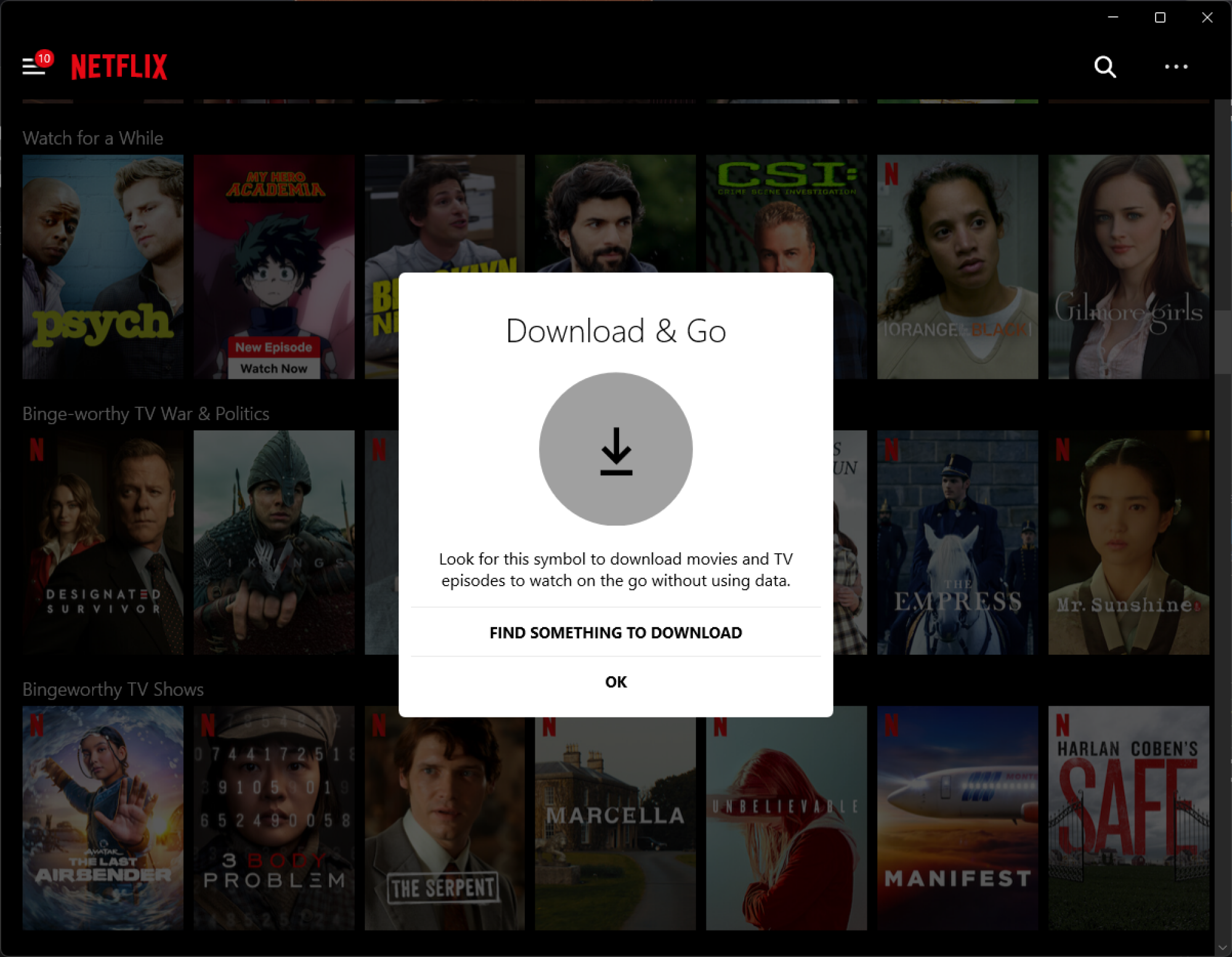 A screenshot of Netflix for Windows with a pop-up informing users about the Downloads feature.